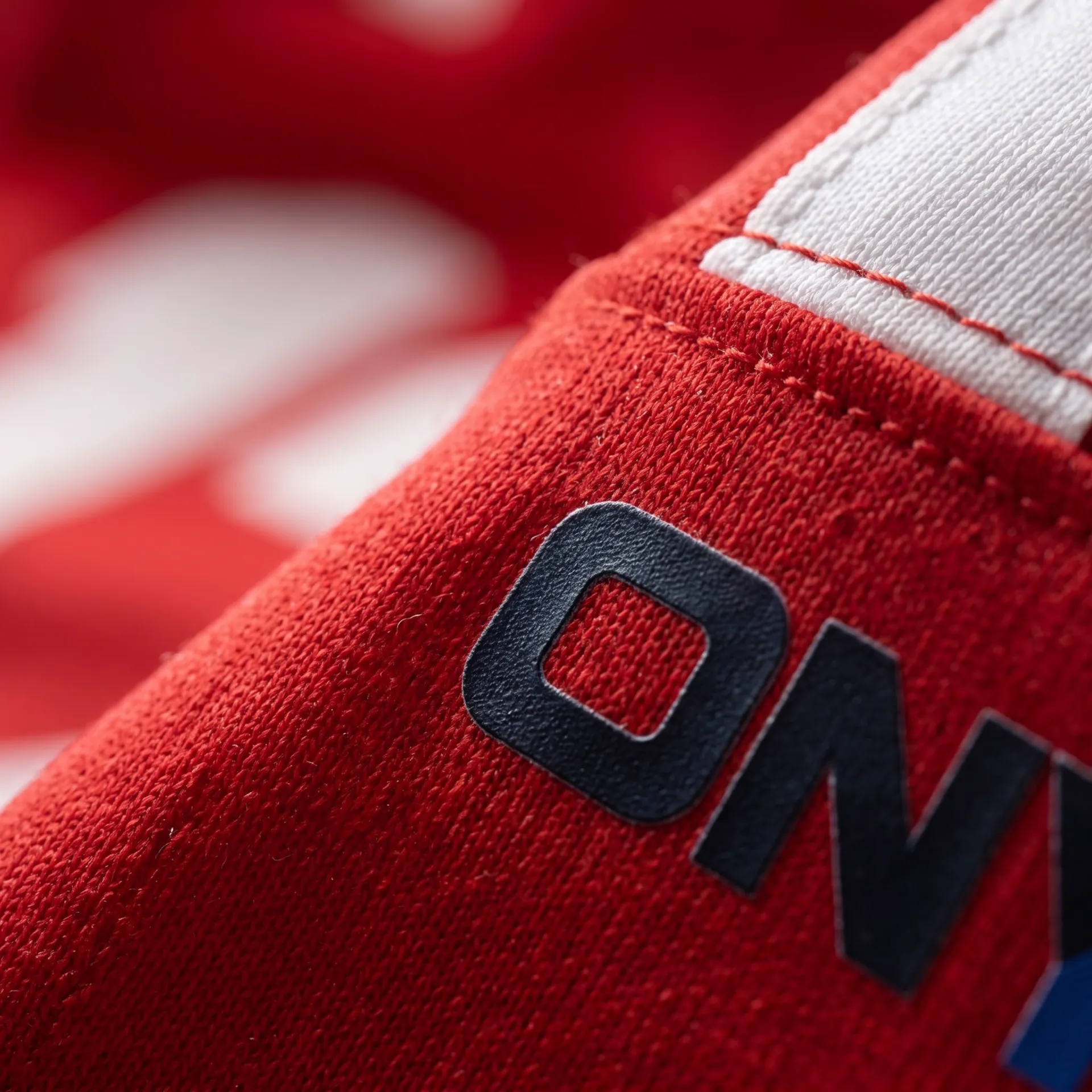 Macro detail of fabric, stitching and logo on the Snap Game Jersey