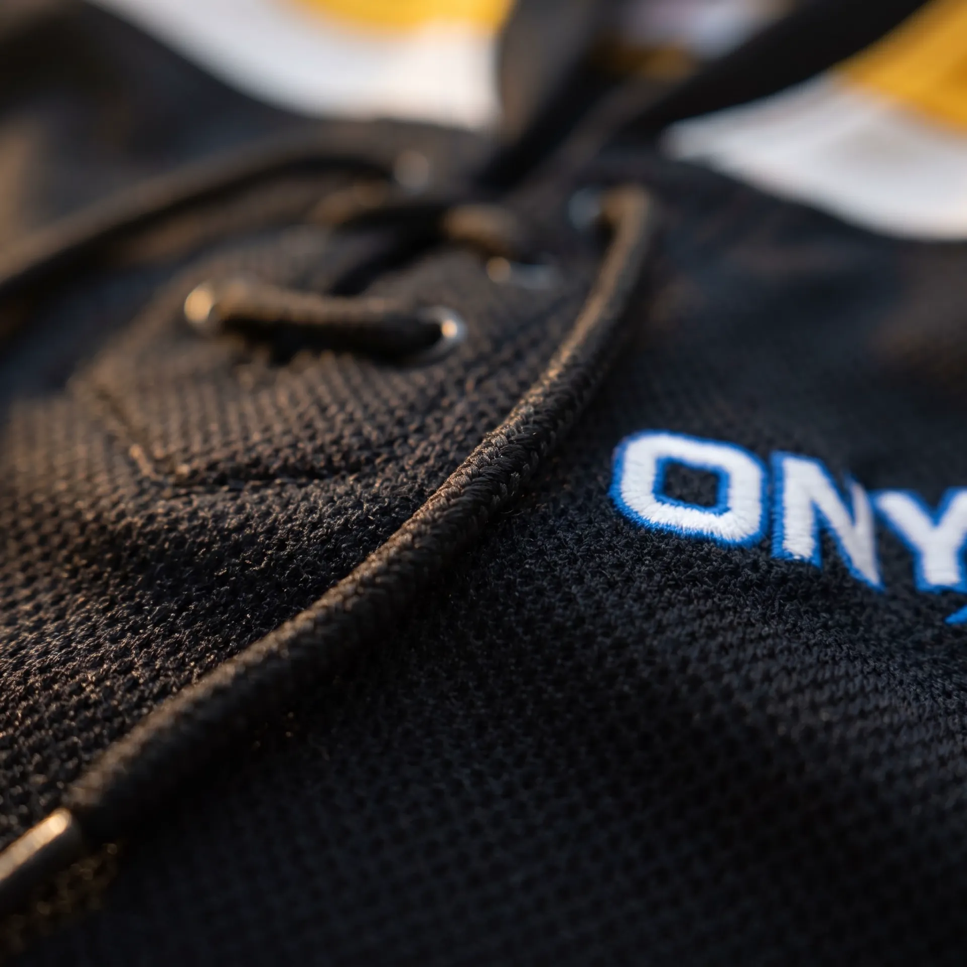 Macro detail of fabric, stitching and logo on the Blue Line Game Jersey