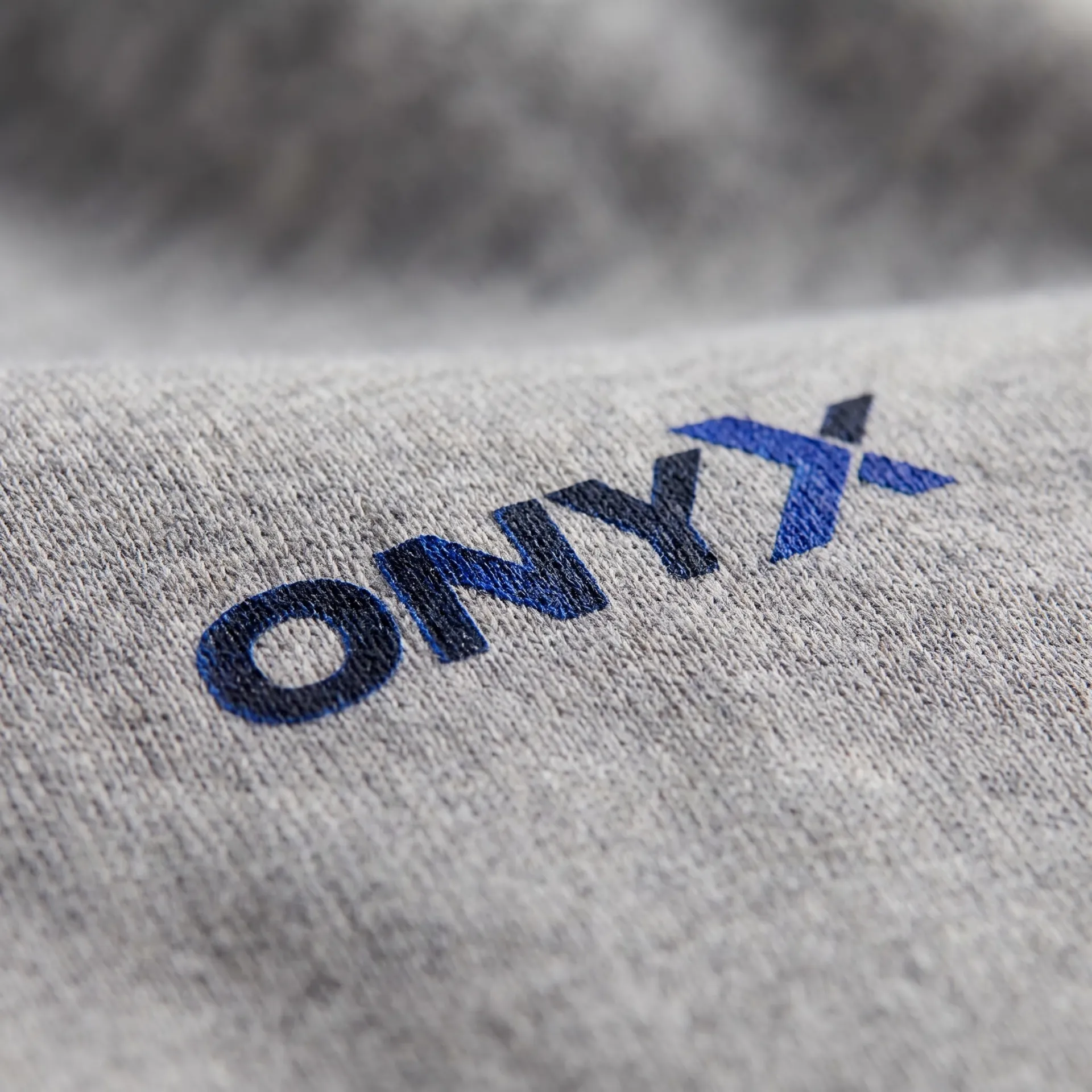 Macro detail of fabric, stitching and logo on the Heavyweight Sweatpants