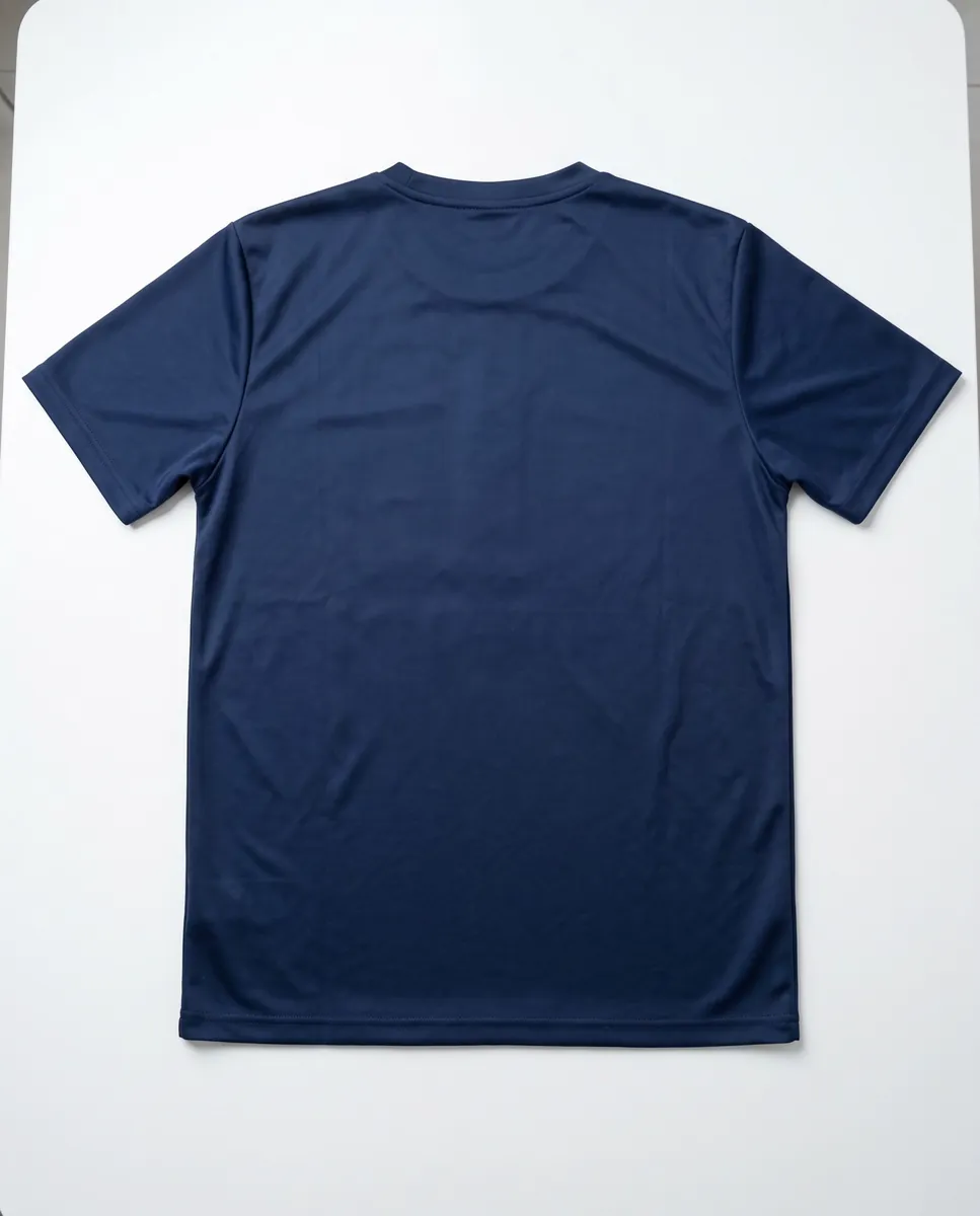 Plain navy short-sleeve sports jersey laid flat for measuring